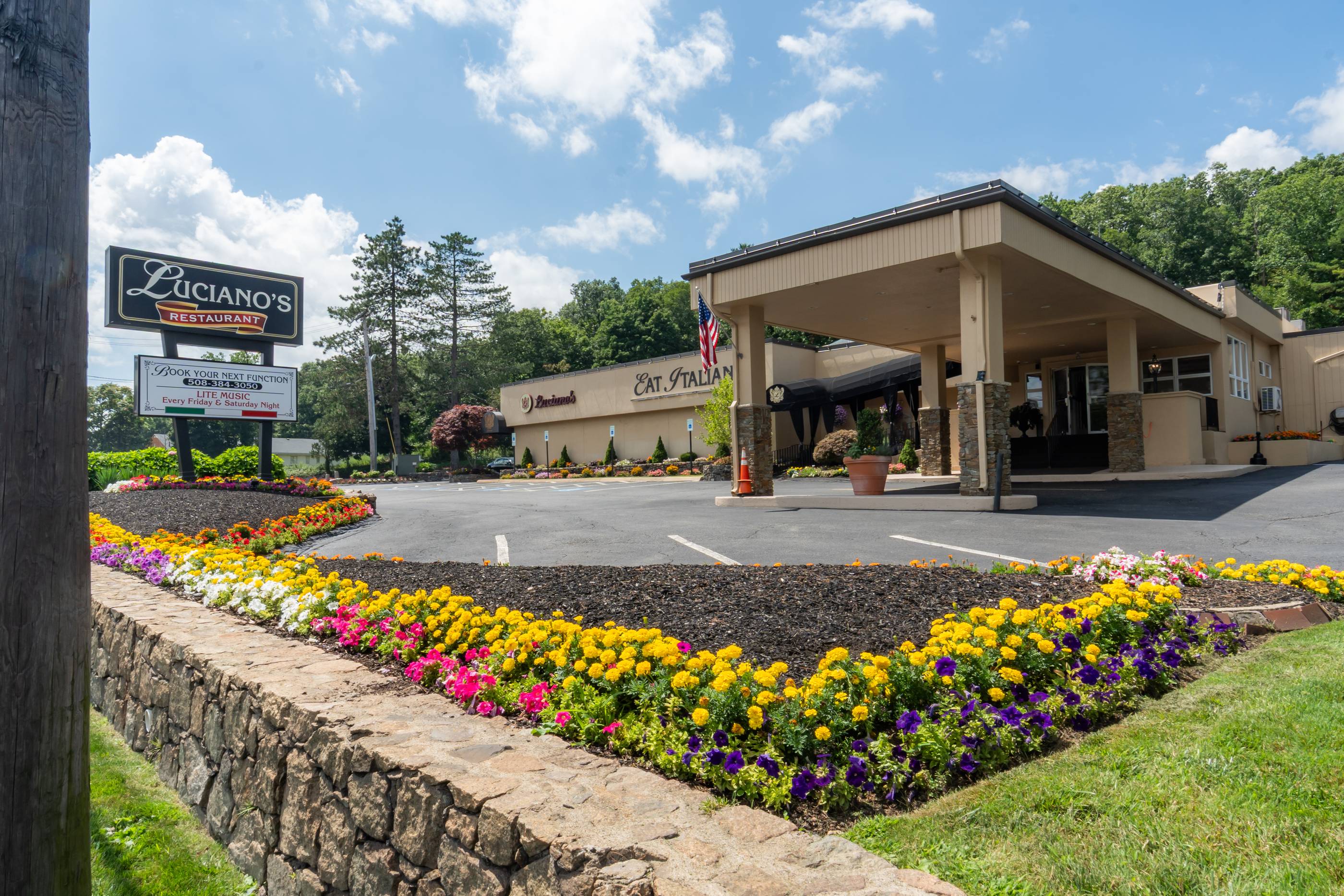 The Luciano’s Restaurant sign and covered entrance on Route 1 in Wrentham